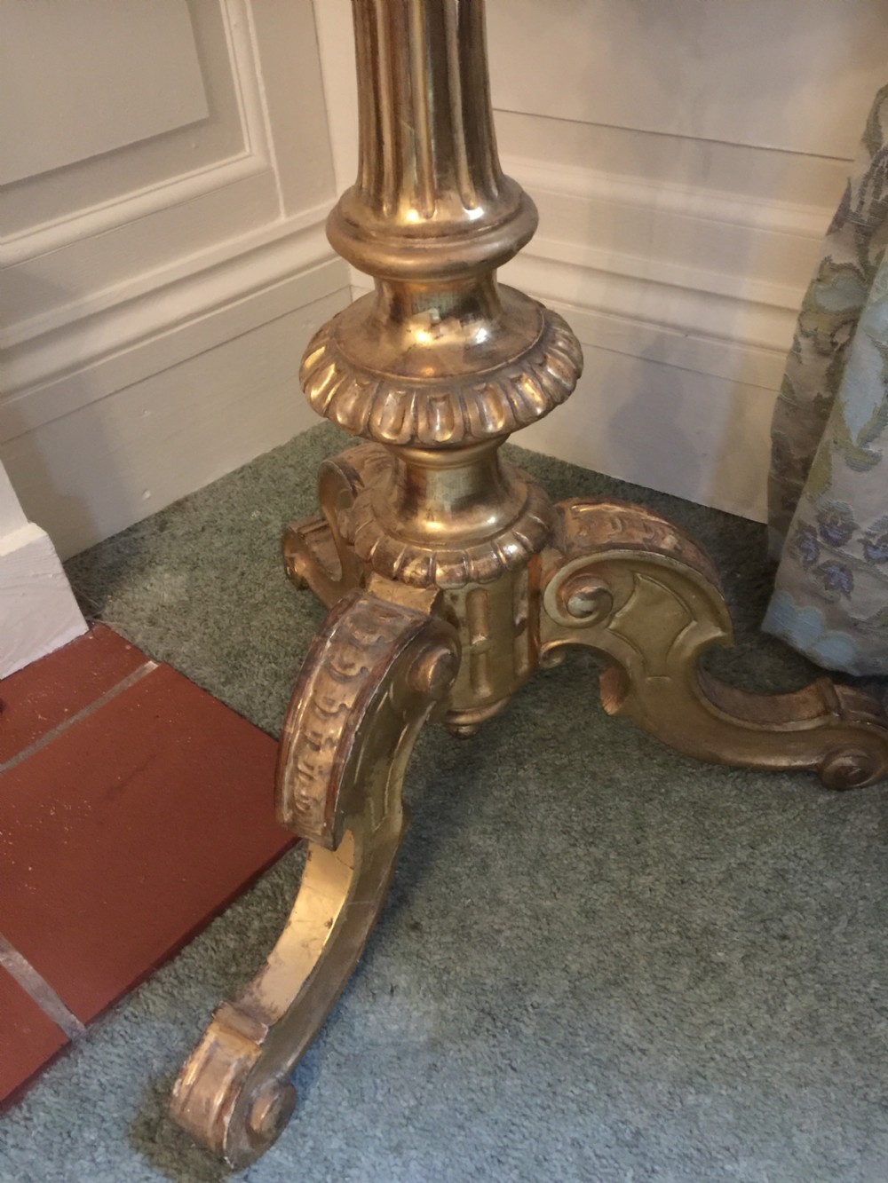 A 19th-century tripod table featuring a carved giltwood pedestal base, egg-and-dart moulding, and a circular variegated grey marble tabletop. View V
