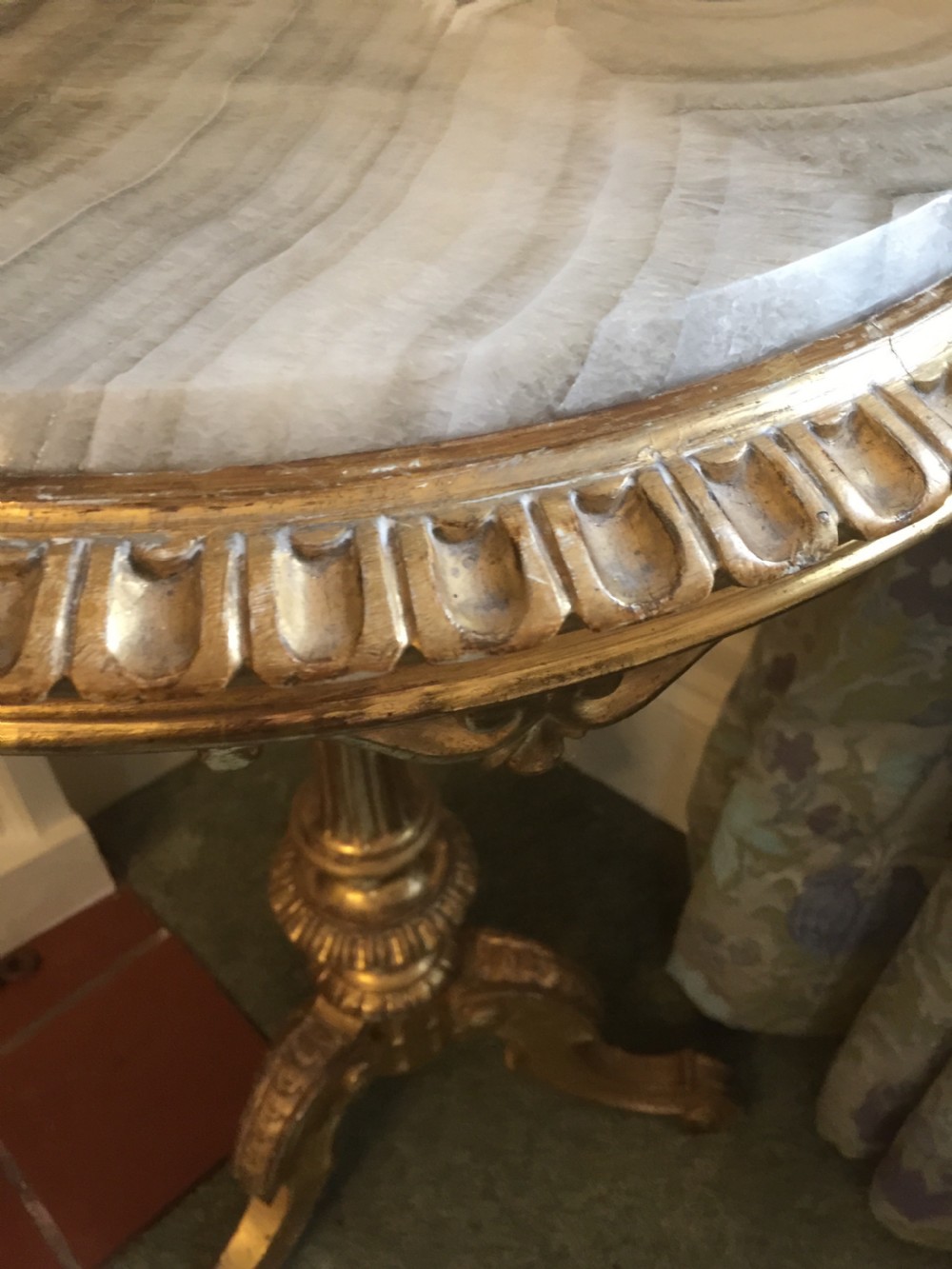 A 19th-century tripod table featuring a carved giltwood pedestal base, egg-and-dart moulding, and a circular variegated grey marble tabletop. View VI