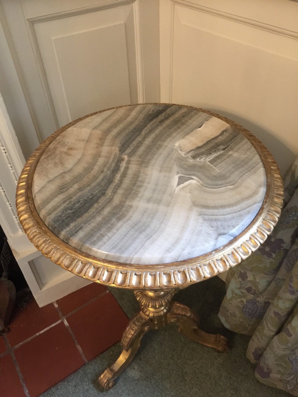 A 19th-century tripod table featuring a carved giltwood pedestal base, egg-and-dart moulding, and a circular variegated grey marble tabletop. View XII