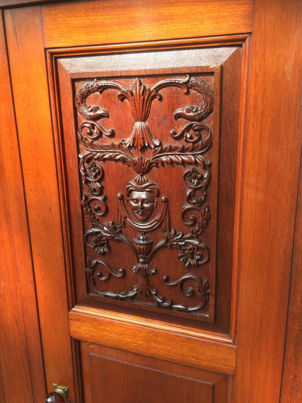 Arts and Crafts walnut hall cupboard with carved panels  View III