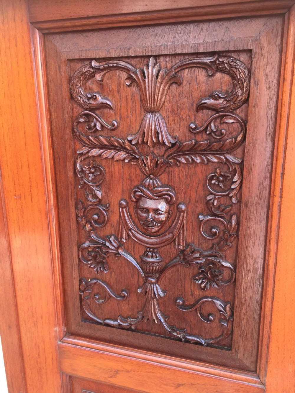 Arts and Crafts walnut hall cupboard with carved panels  View IX