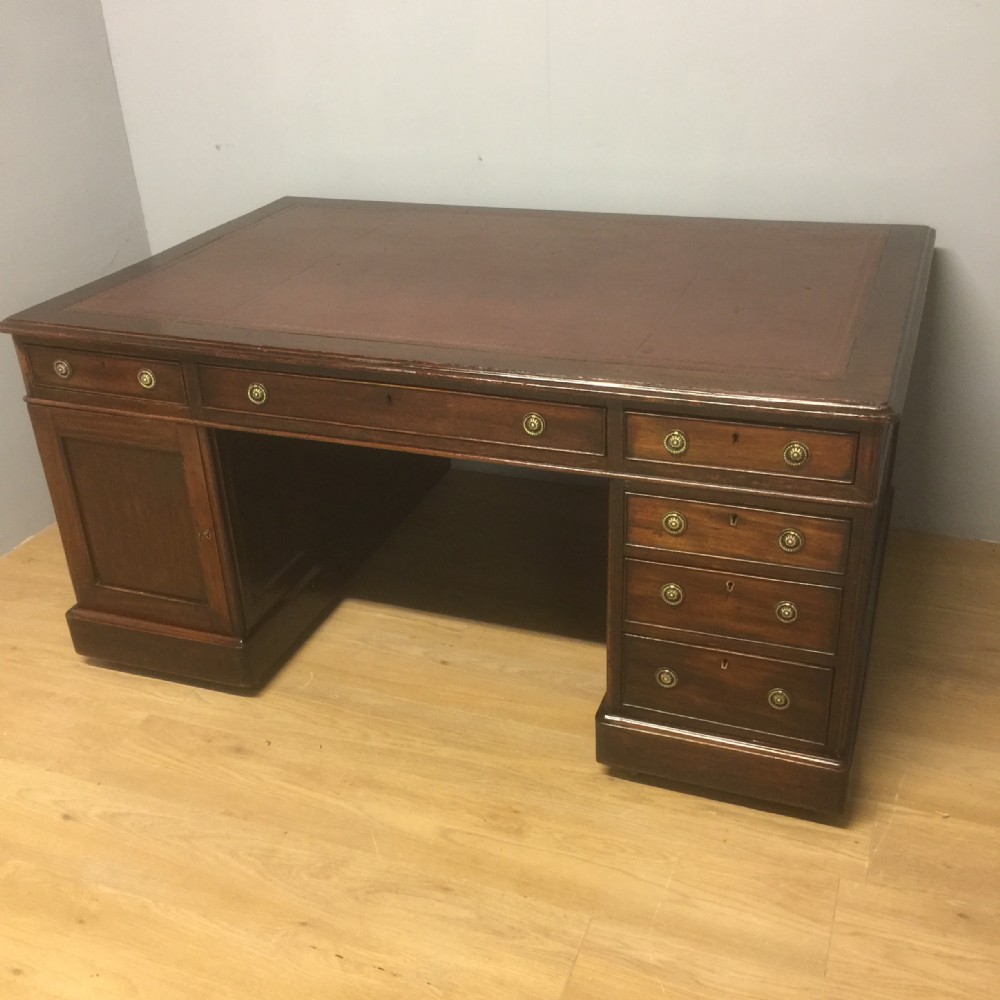 Nineteenth century mahogany partners desk with tooled leather top 