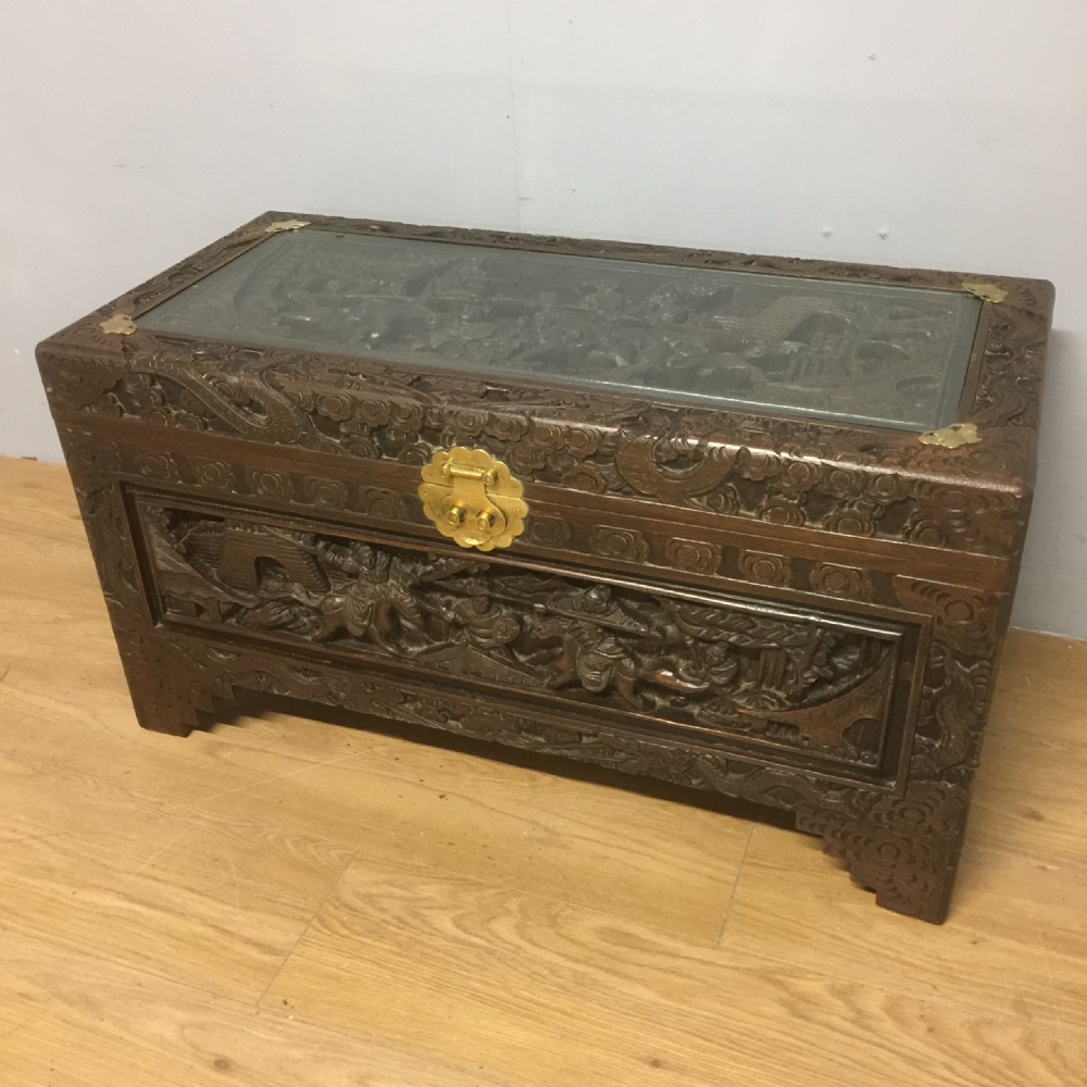 Carved camphorwood chest withbrass fittings 