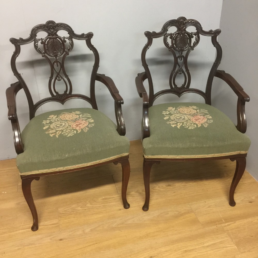 Pair of Edwardian carved mahogany armchairs