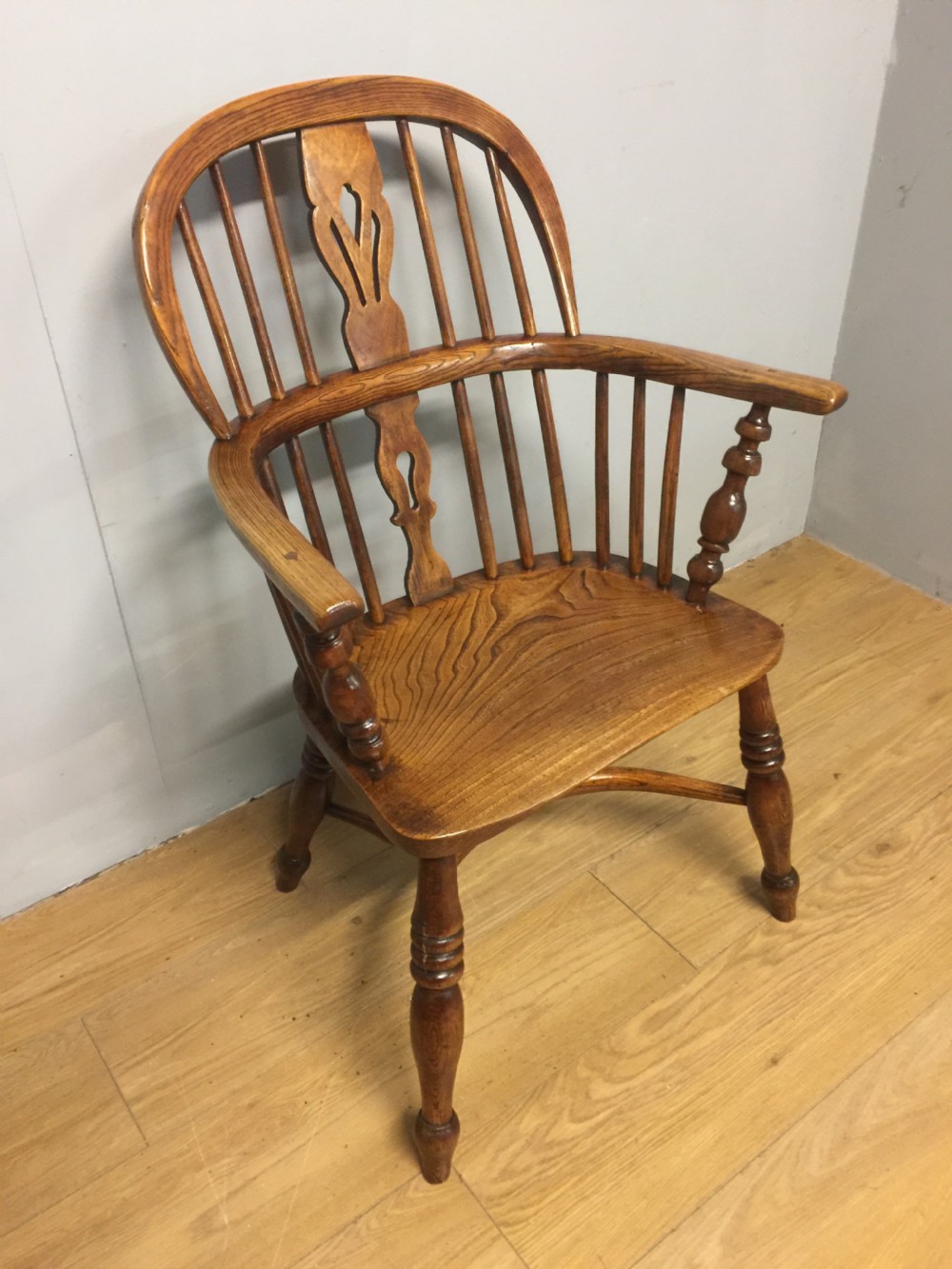 Nineteenth century ash and elm Windsor chair with crinoline understretcher  View II