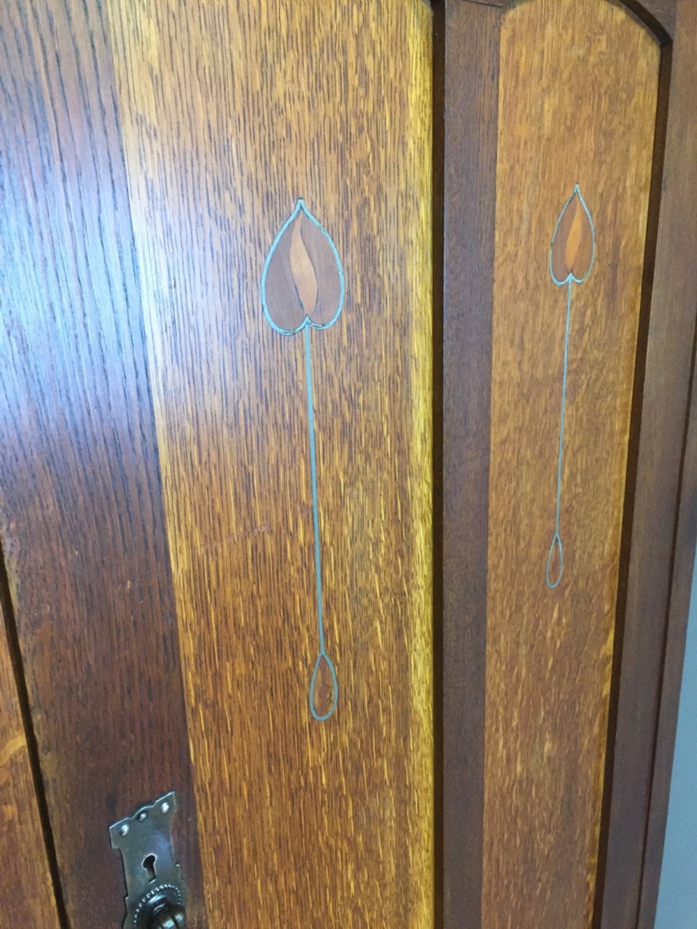 Solid oak Arts and Crafts inlaid three door wardrobe  View IV