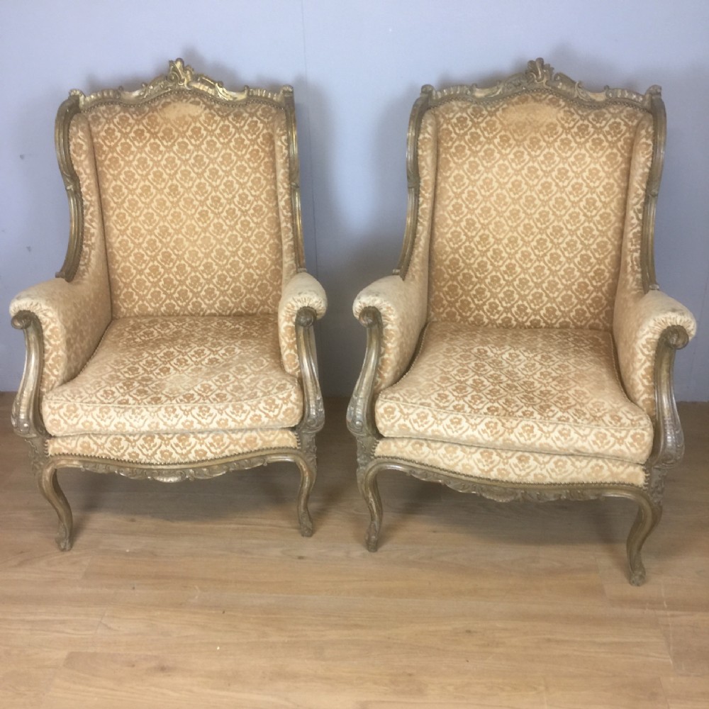 Pair of nineteenth century French carved and gilded armchairs 