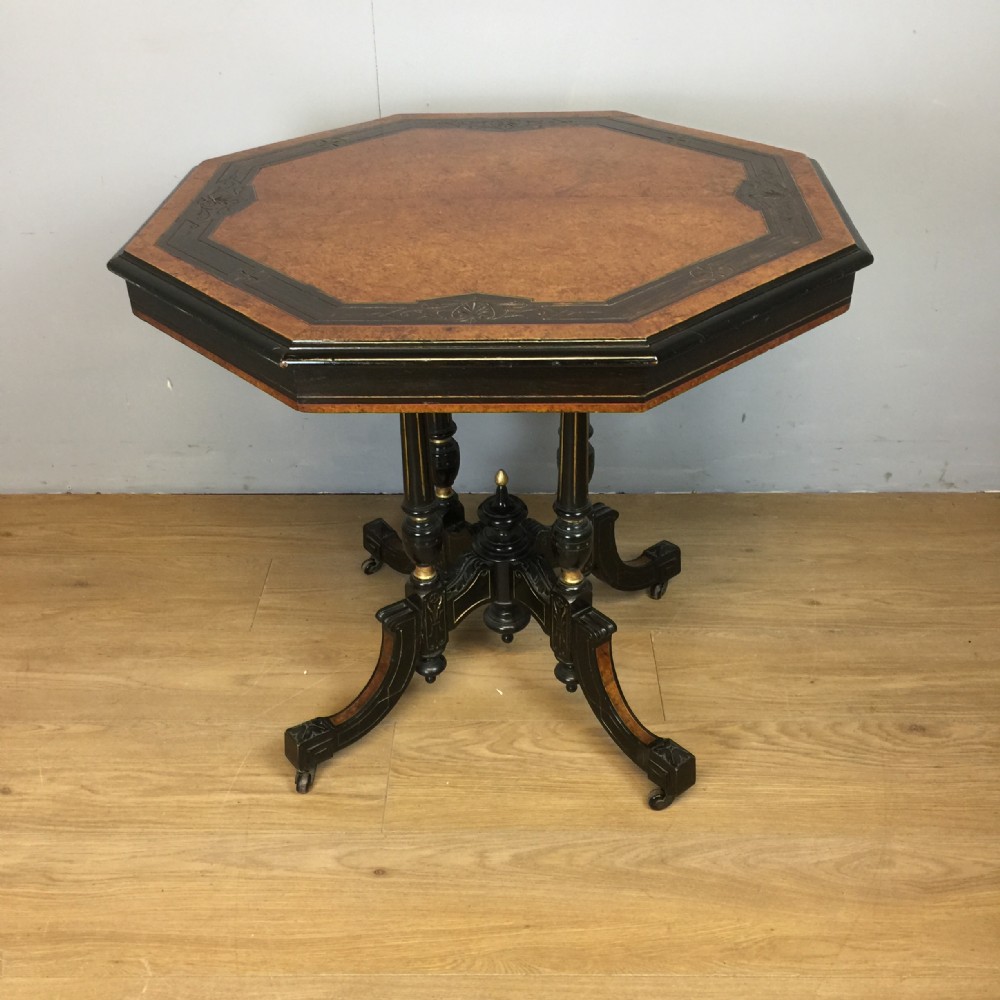 Ebonised aesthetic movement amboyna octagonal table 