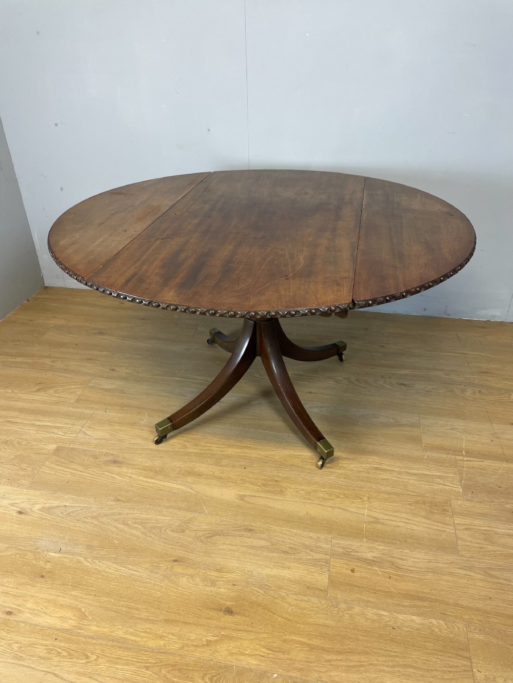 Regency mahogany circular drop leaf dining table 