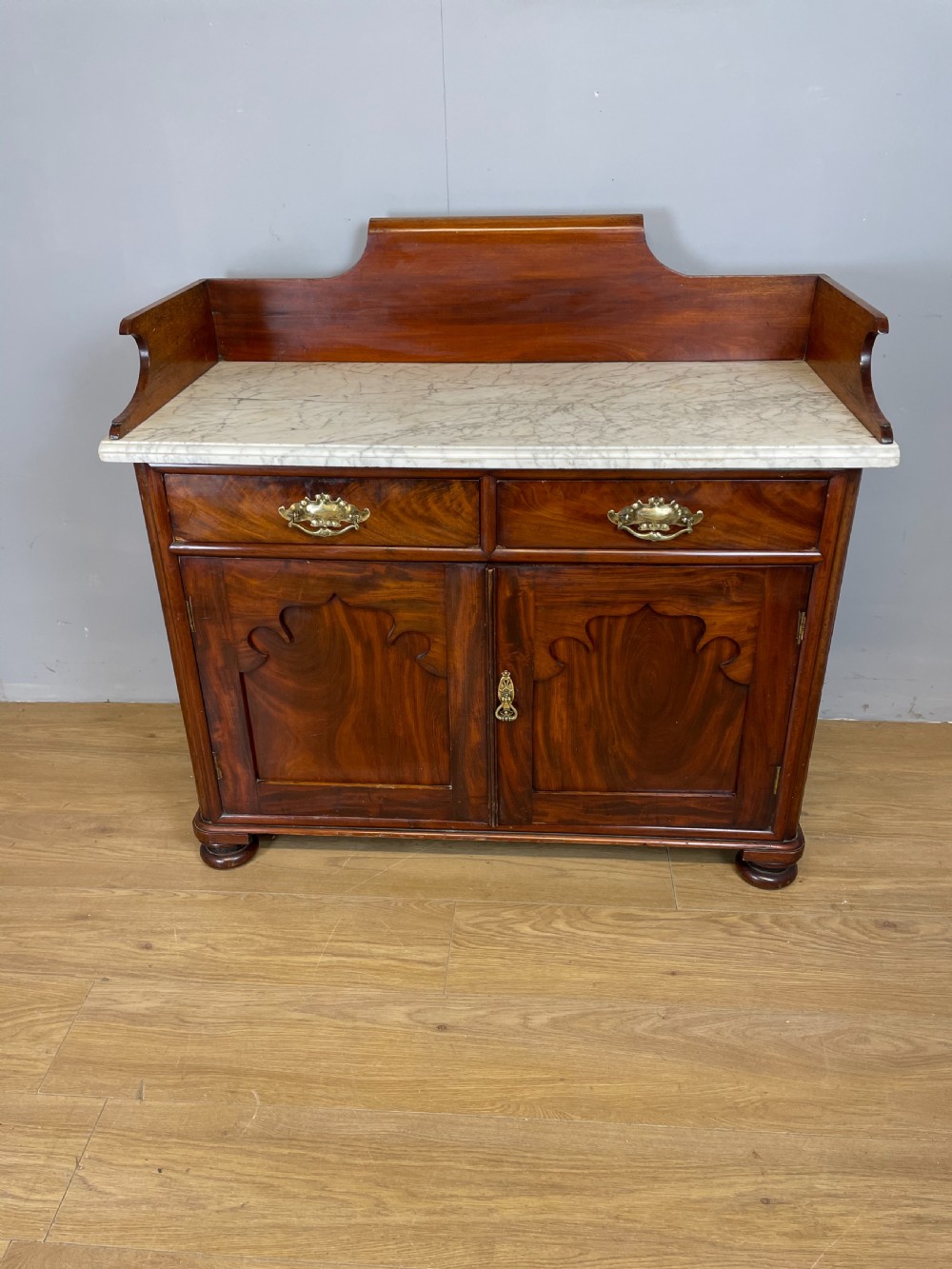 Nineteenth century Flame mahogany marble topped side cabinet 