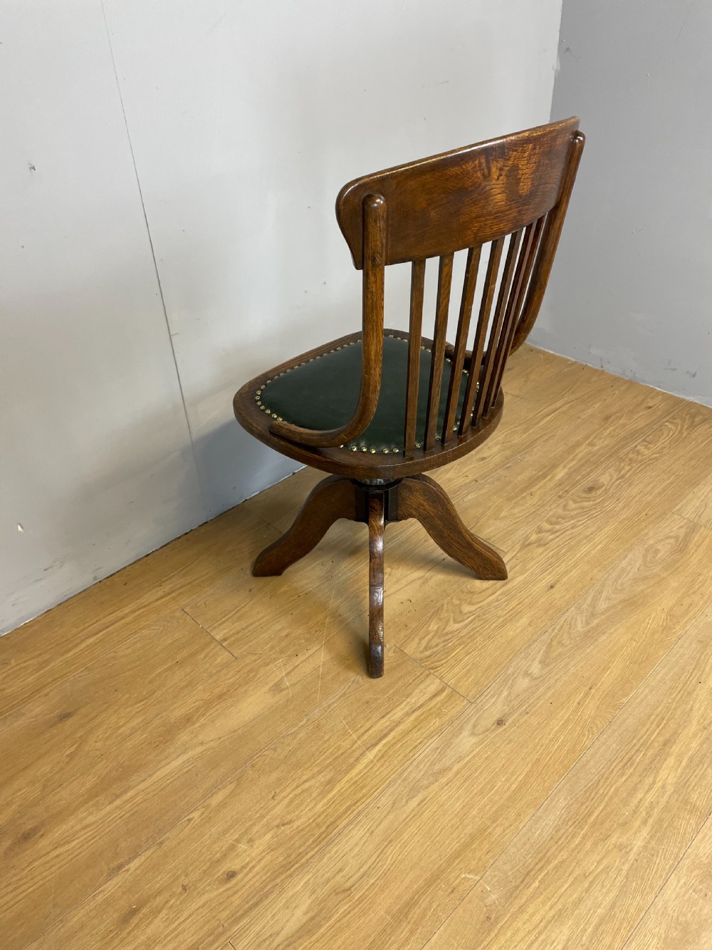 Nineteenth century solid oak revolving desk chair in green leather  View II