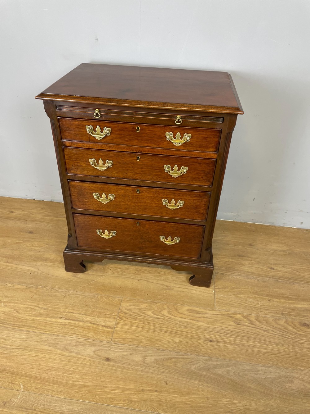 Nineteenth century small mahogany bachelors chest View XI