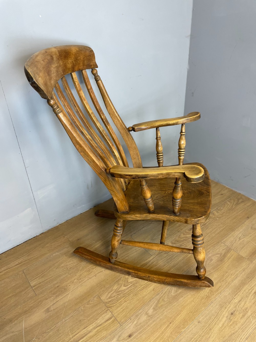Nineteenth century slat back elm and beech farmhouse rocking chair View II