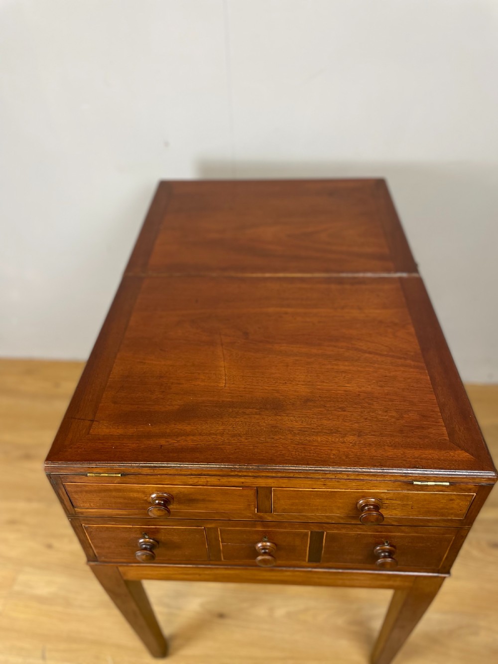 A Late Georgian inlaid mahogany collectors cabinet with square tapered legs, brass keyhole escutcheons, side knobs, and multiple drawers. View XIII