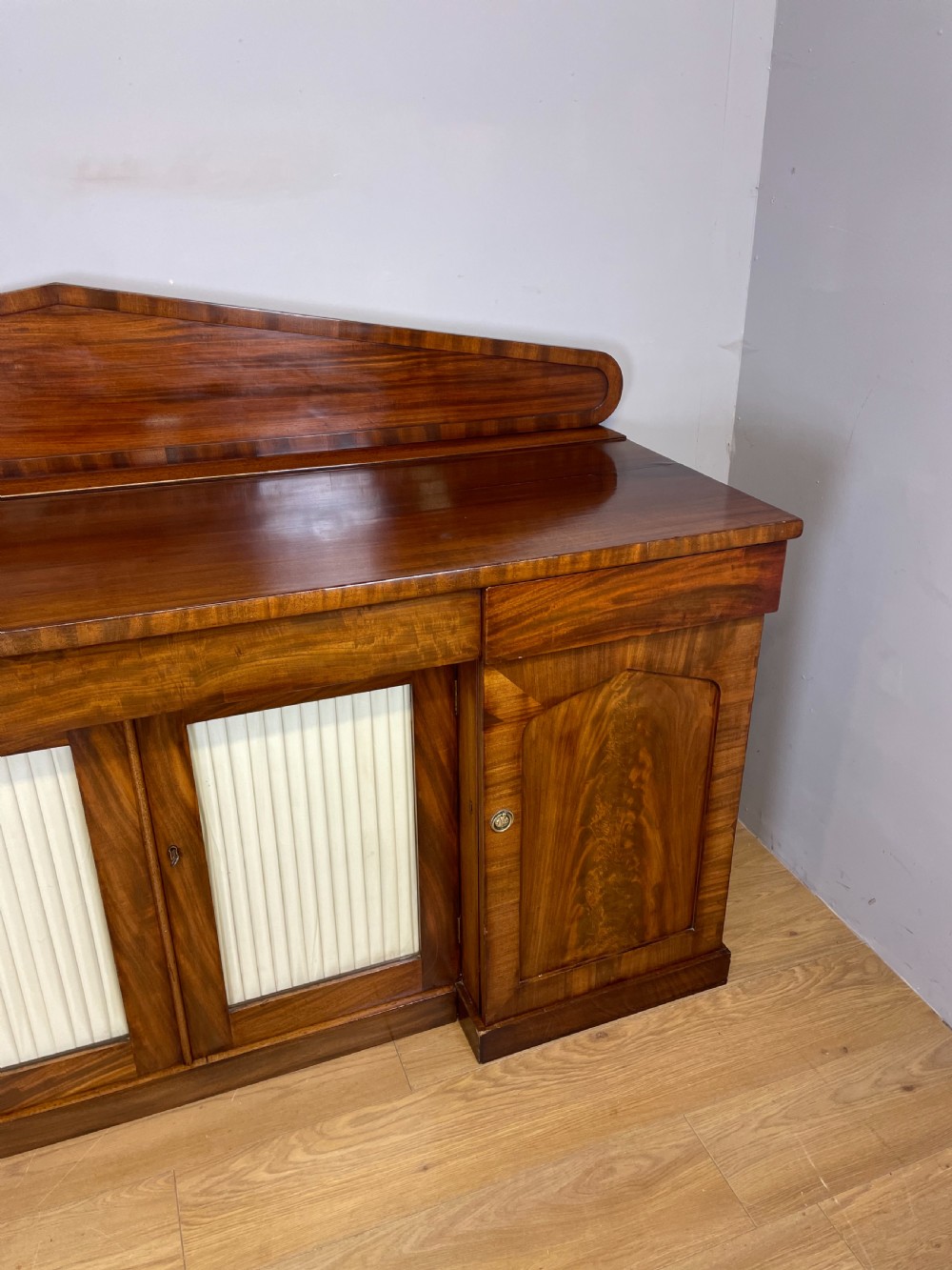 Late Georgian flame mahogany four door sideboard  View IV