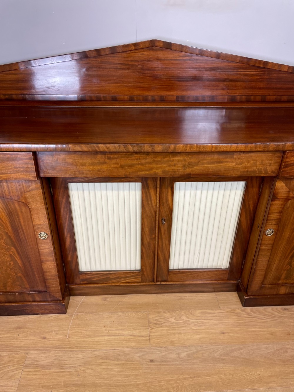 Late Georgian flame mahogany four door sideboard  View V