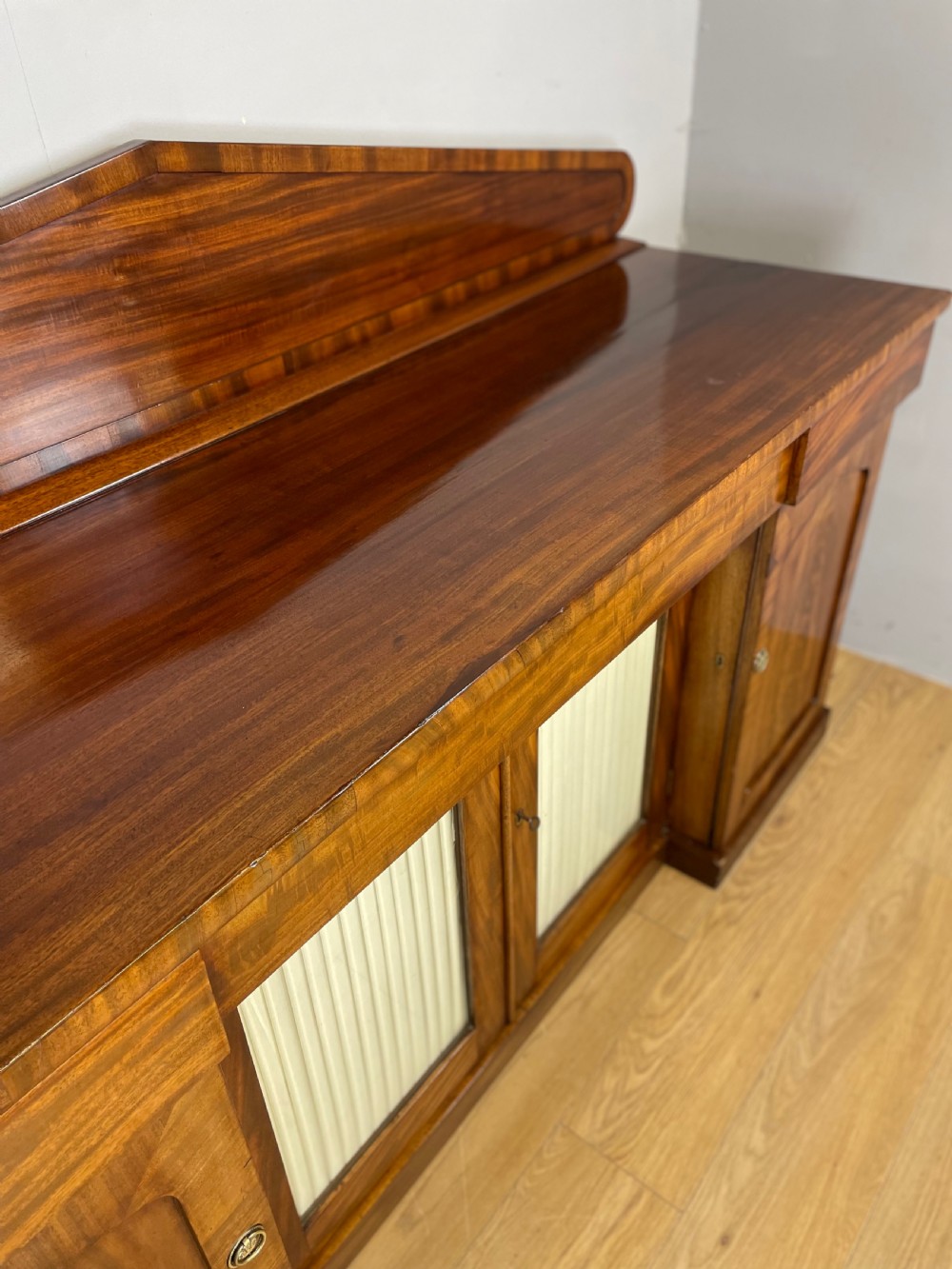 Late Georgian flame mahogany four door sideboard  View VII