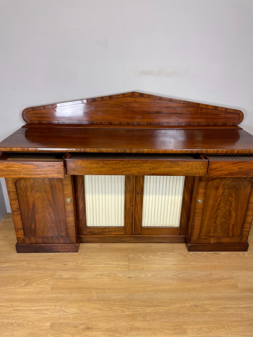 Late Georgian flame mahogany four door sideboard  View VIII