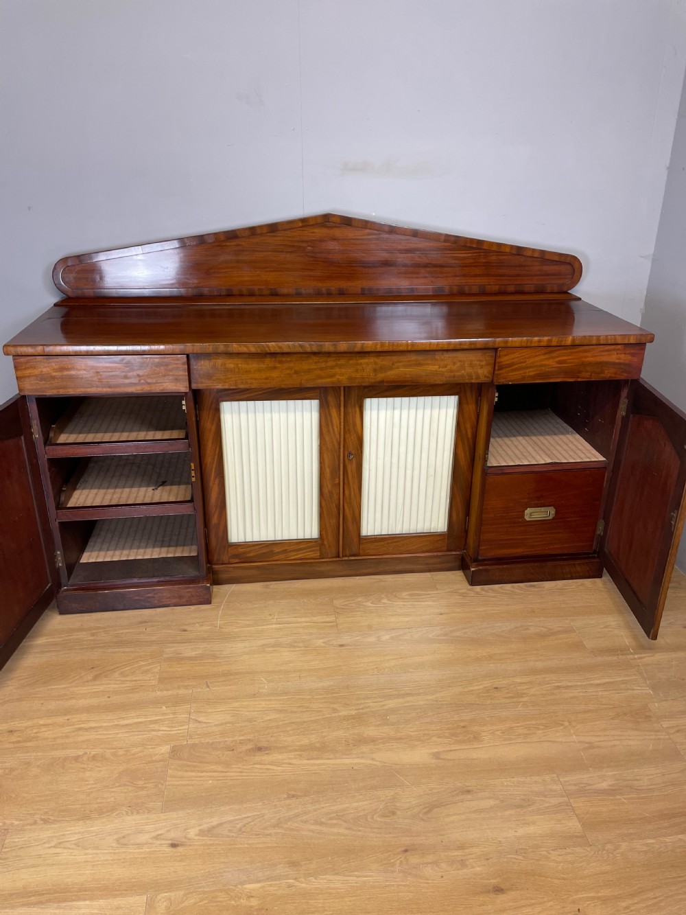 Late Georgian flame mahogany four door sideboard  View IX