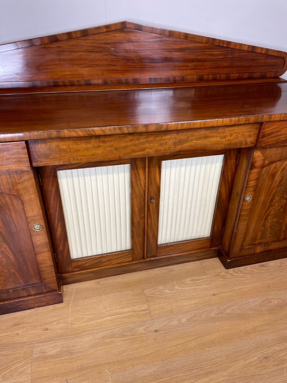 Late Georgian flame mahogany four door sideboard  View XI