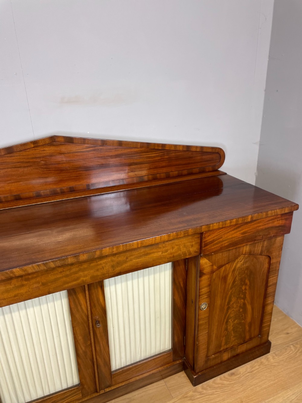 Late Georgian flame mahogany four door sideboard  View XII