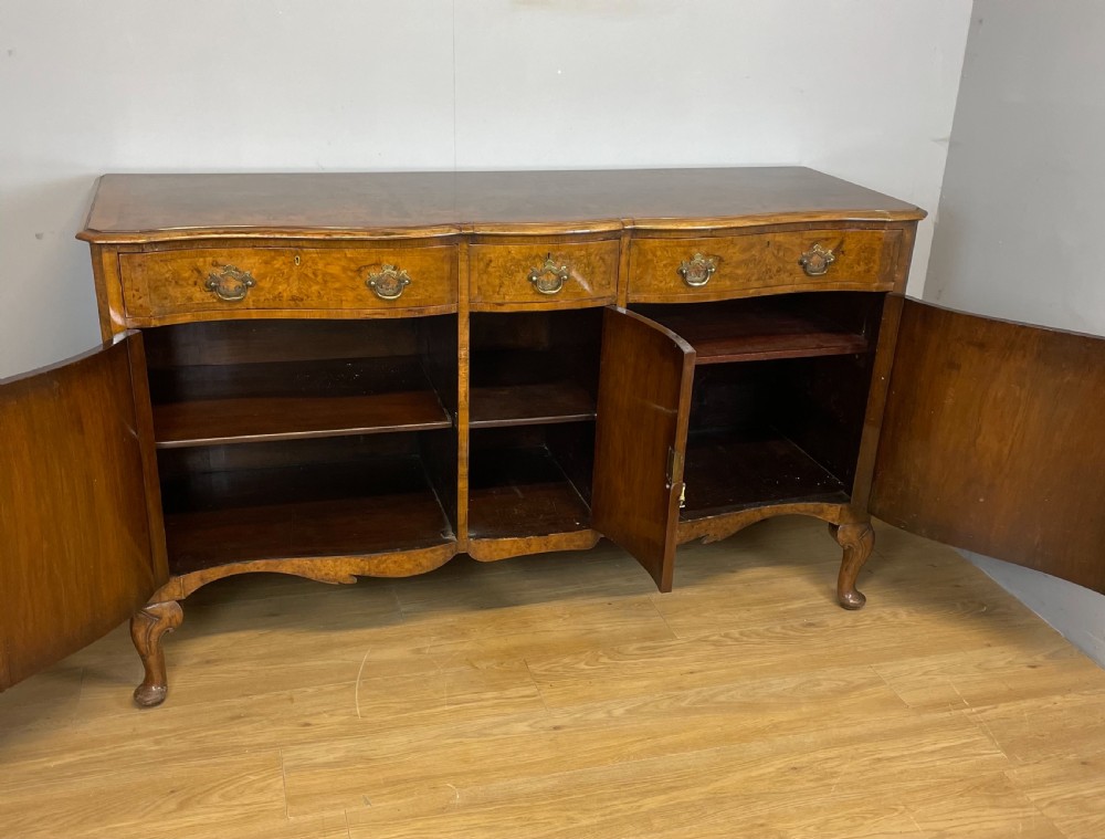 Serpentine fronted burr walnut sideboard by Maple and Co  View XII
