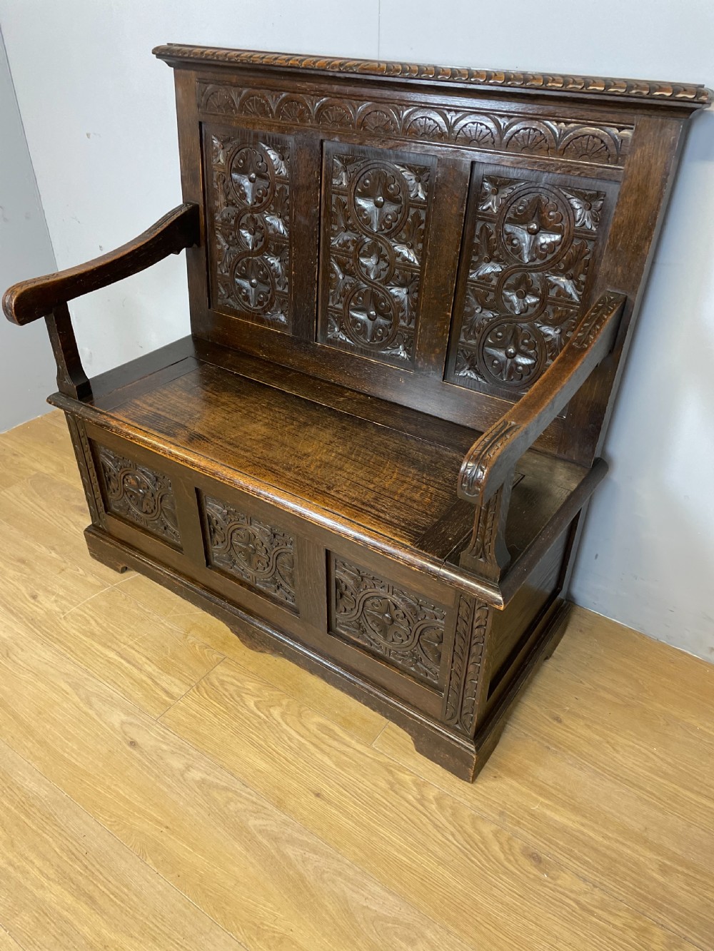 Nineteenth century carved oak settle View III