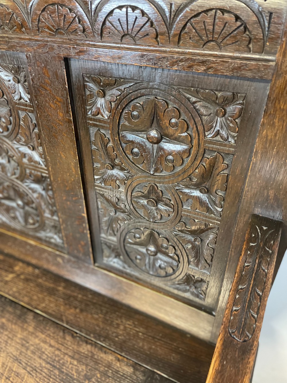 Nineteenth century carved oak settle View IV