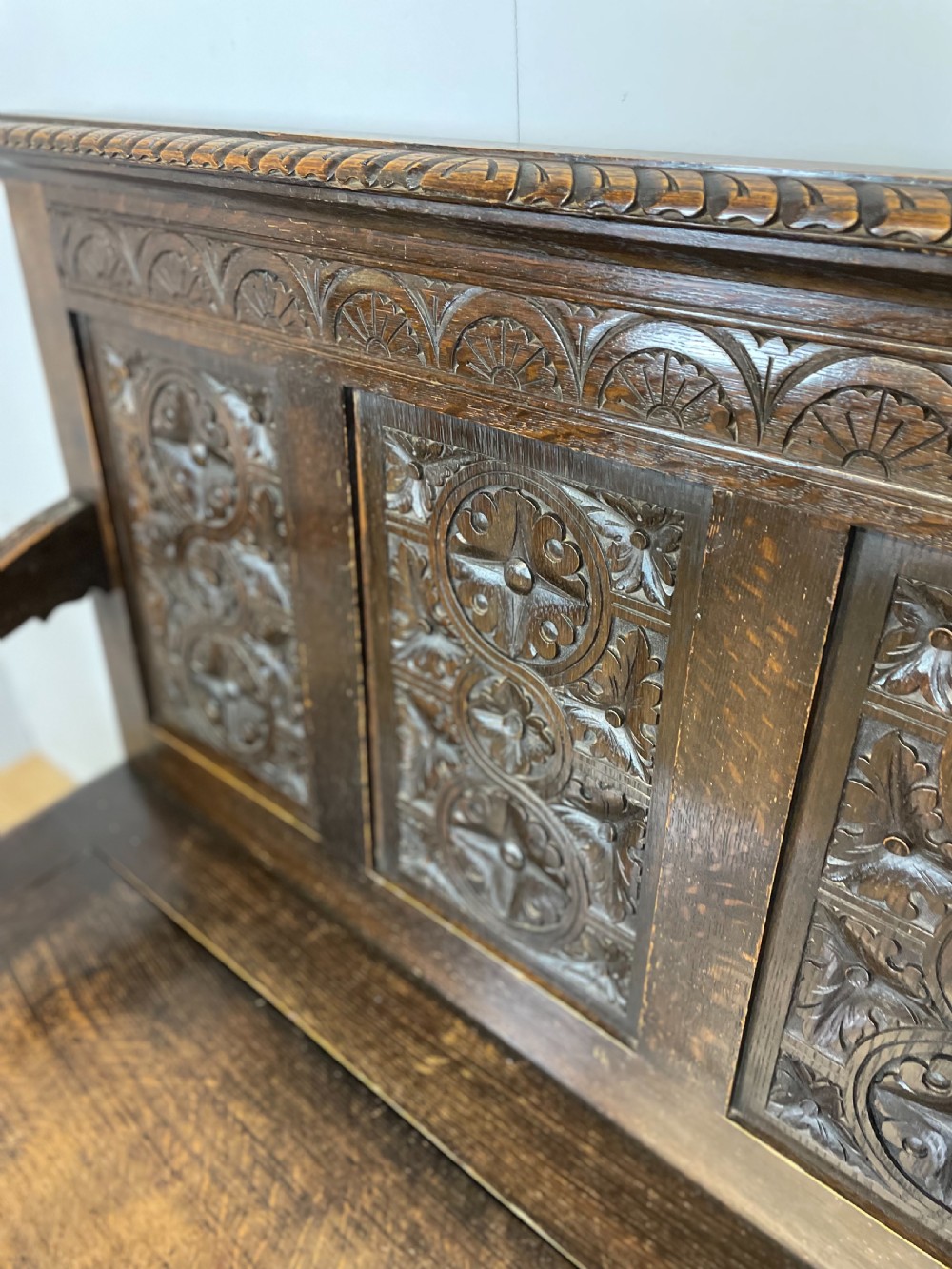 Nineteenth century carved oak settle View V