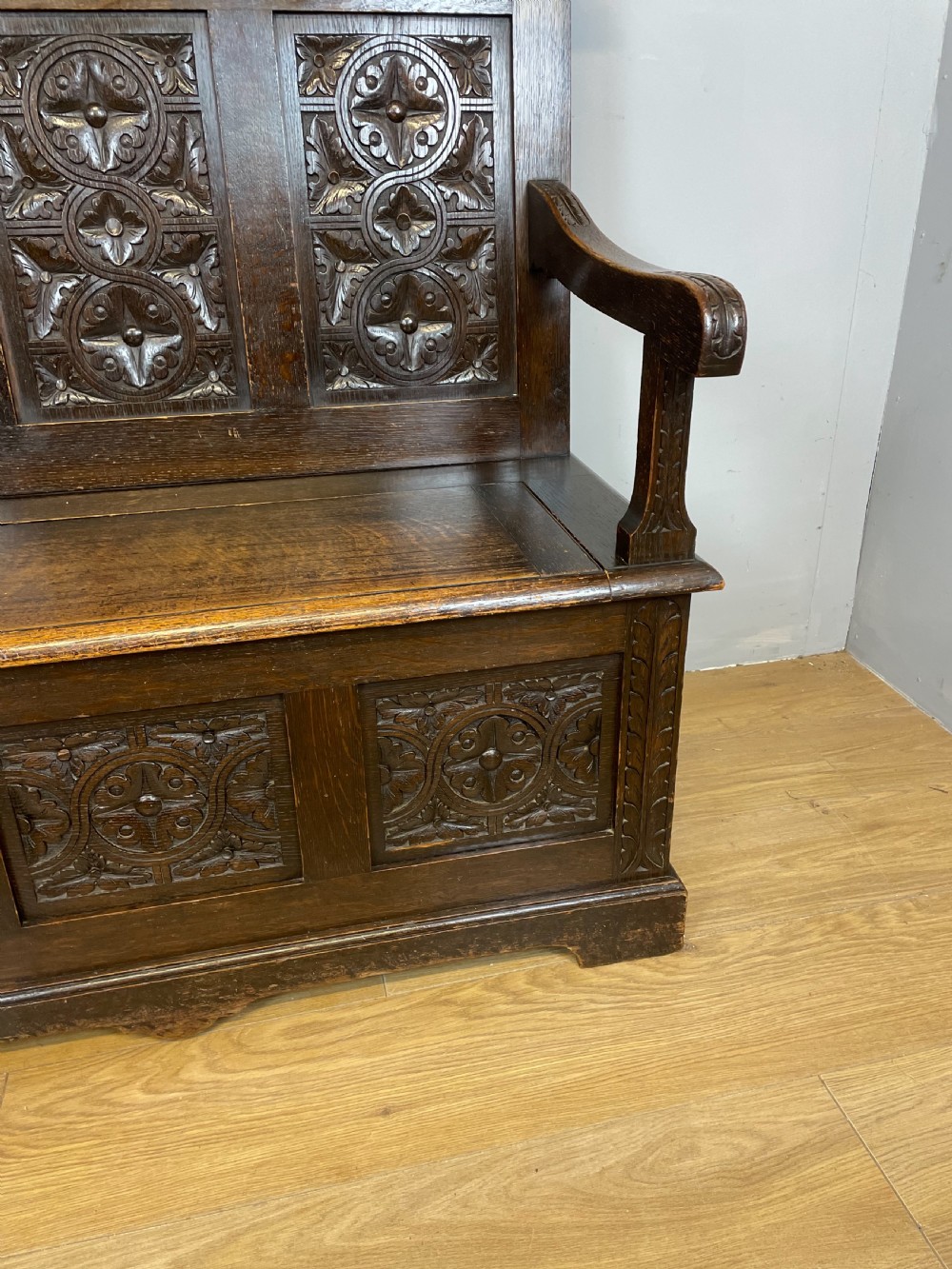 Nineteenth century carved oak settle View XI