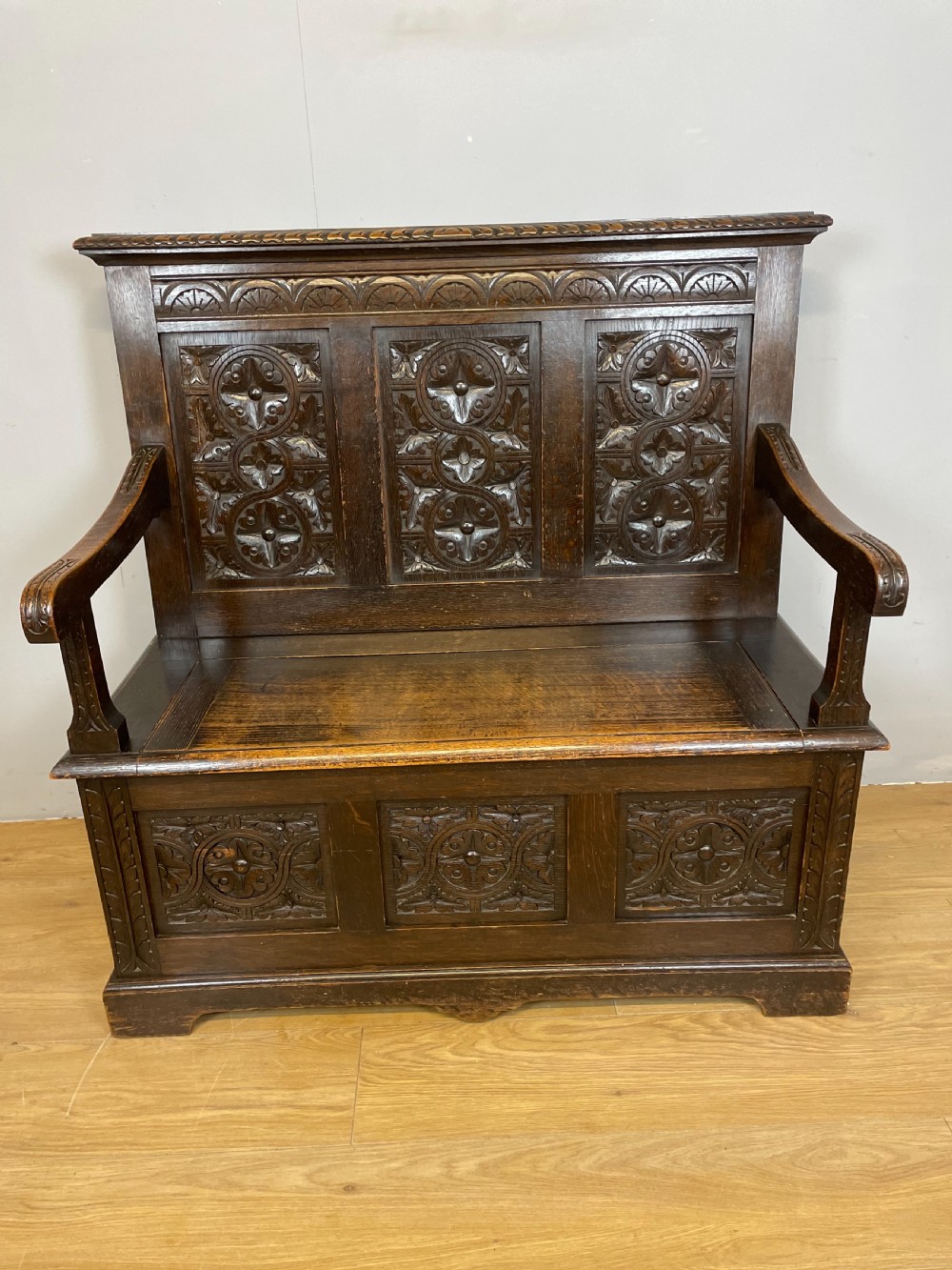 Nineteenth century carved oak settle View XII