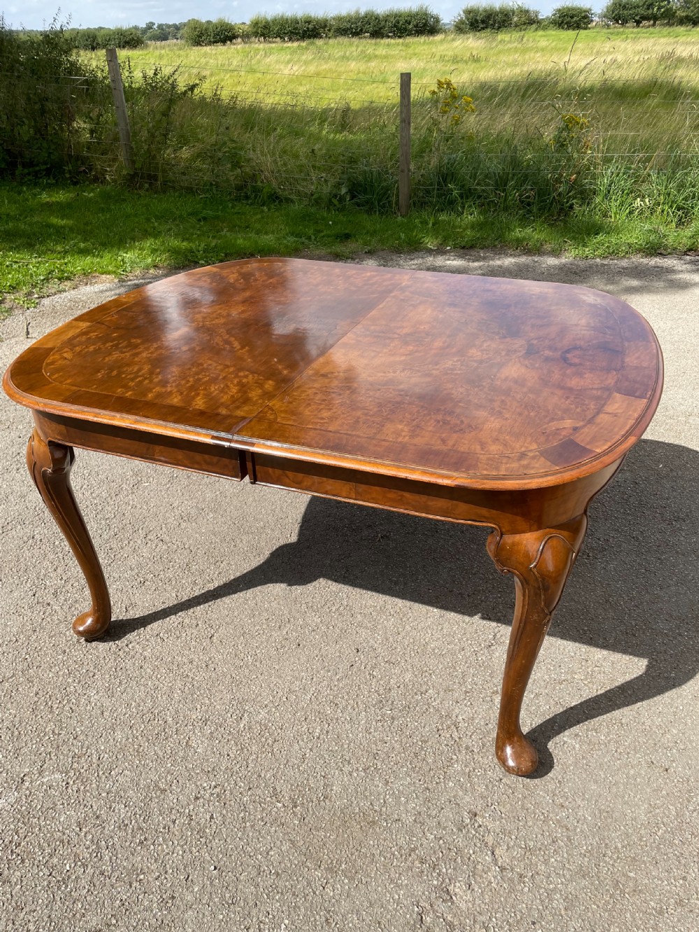 Burr walnut extending dining table by Maple and Co  View III