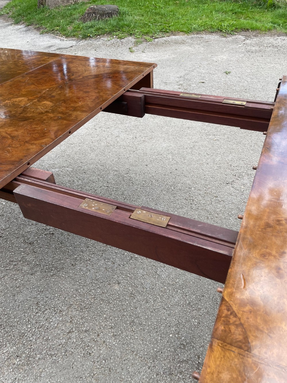Burr walnut extending dining table by Maple and Co  View IV