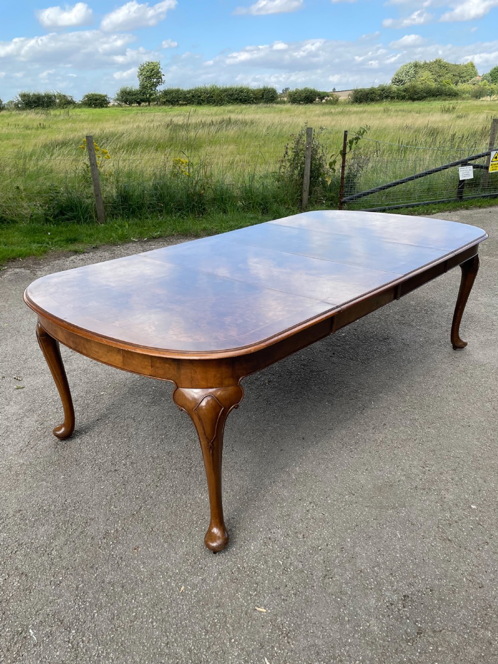 Burr walnut extending dining table by Maple and Co  View V