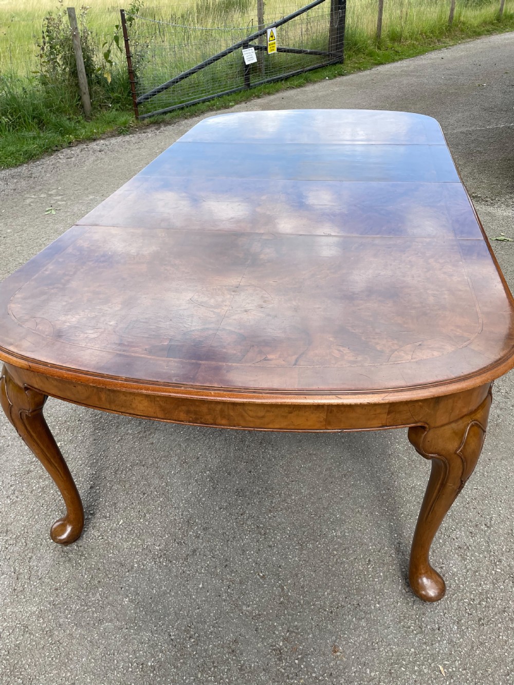 Burr walnut extending dining table by Maple and Co  View VI