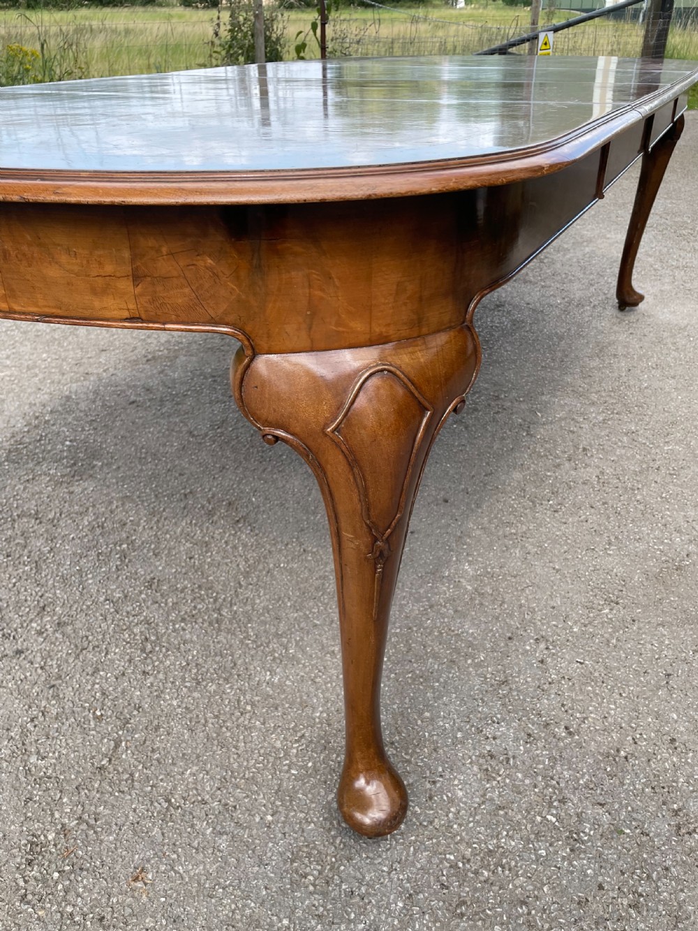 Burr walnut extending dining table by Maple and Co  View VII