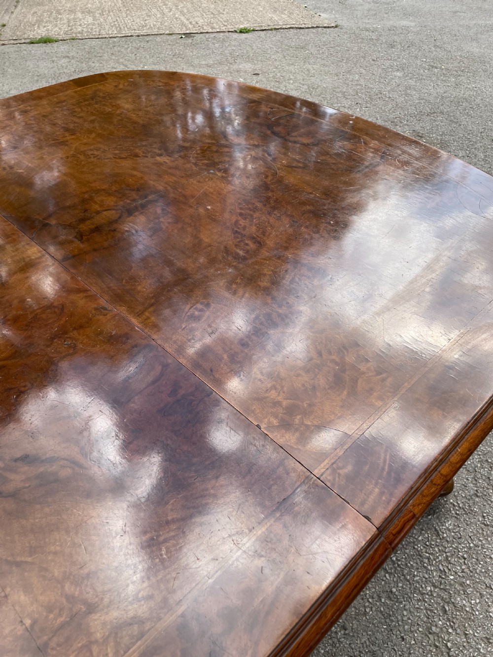 Burr walnut extending dining table by Maple and Co  View VIII