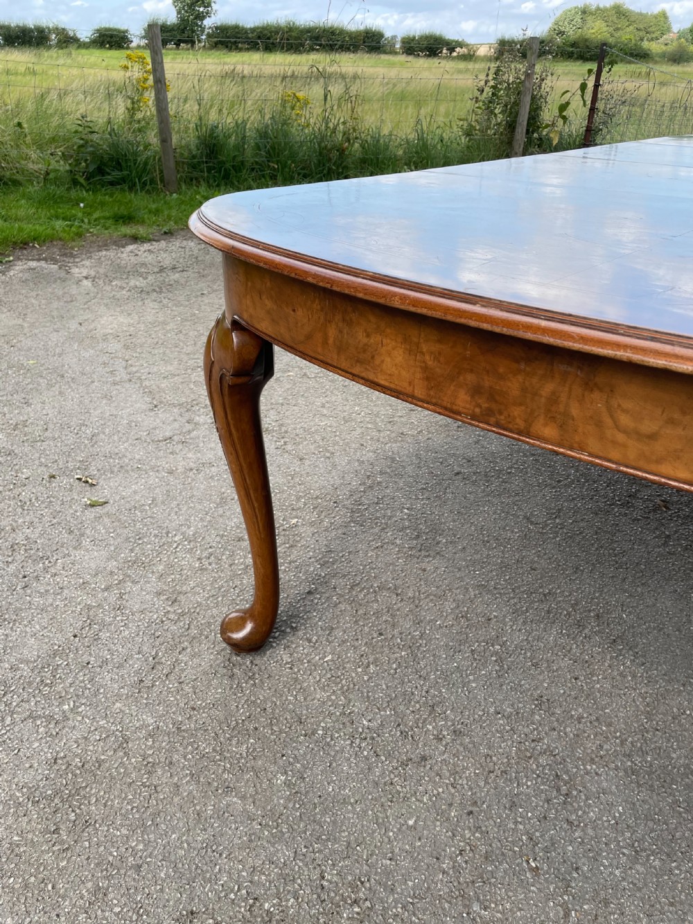 Burr walnut extending dining table by Maple and Co  View IX