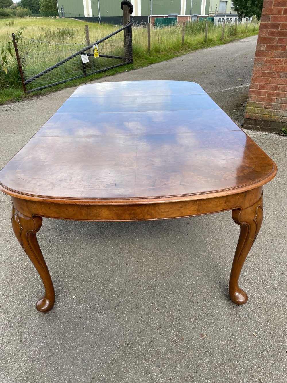 Burr walnut extending dining table by Maple and Co  View X