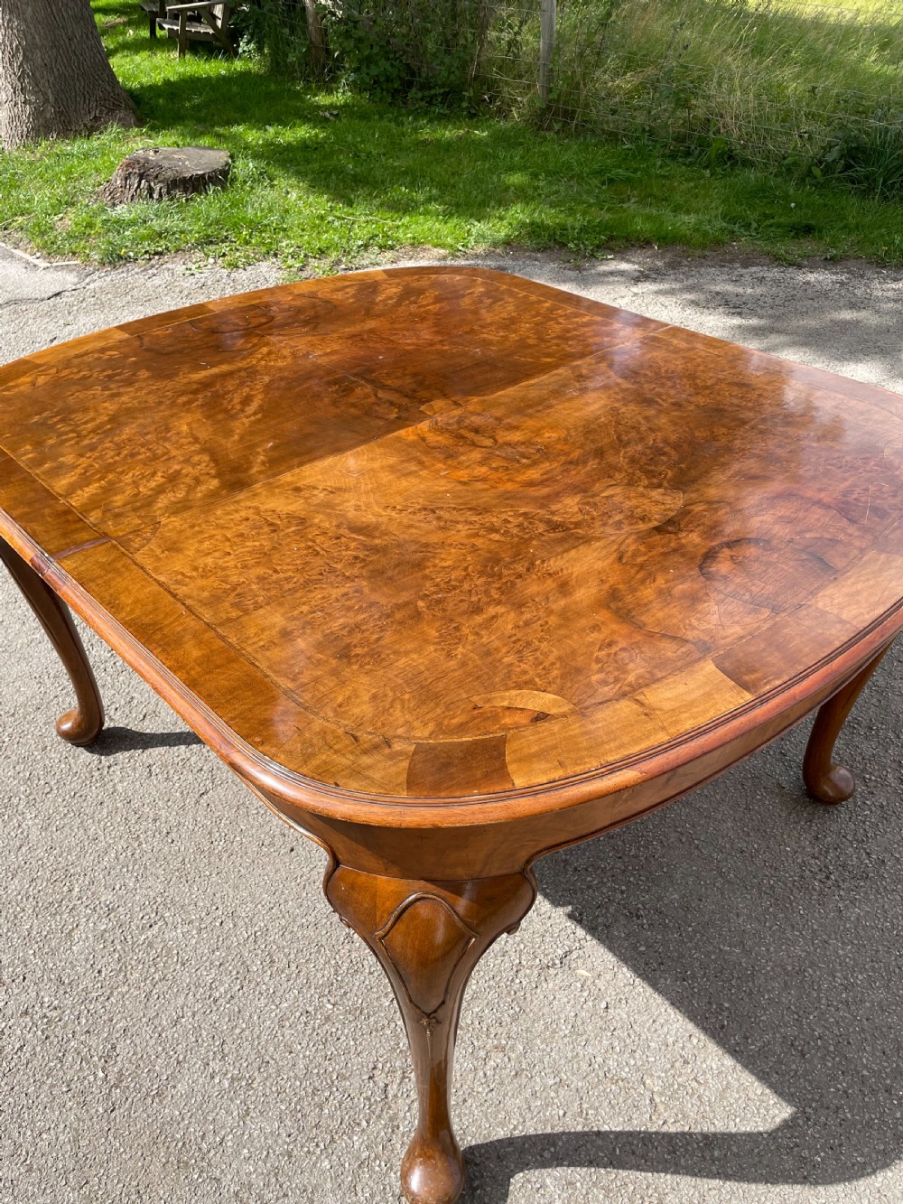 Burr walnut extending dining table by Maple and Co  View XII
