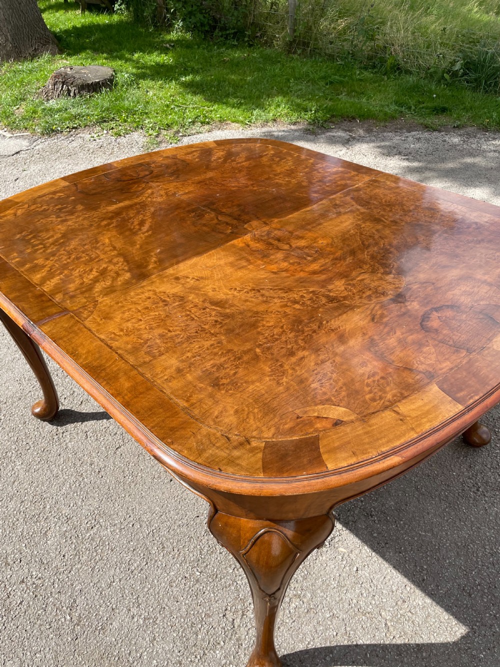 Burr walnut extending dining table by Maple and Co  View XIV