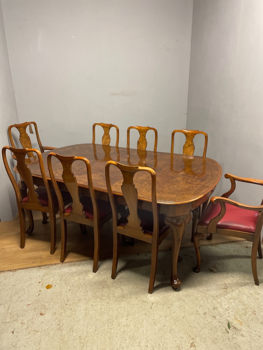 Burr walnut extending dining table by Maple and Co  View XVI