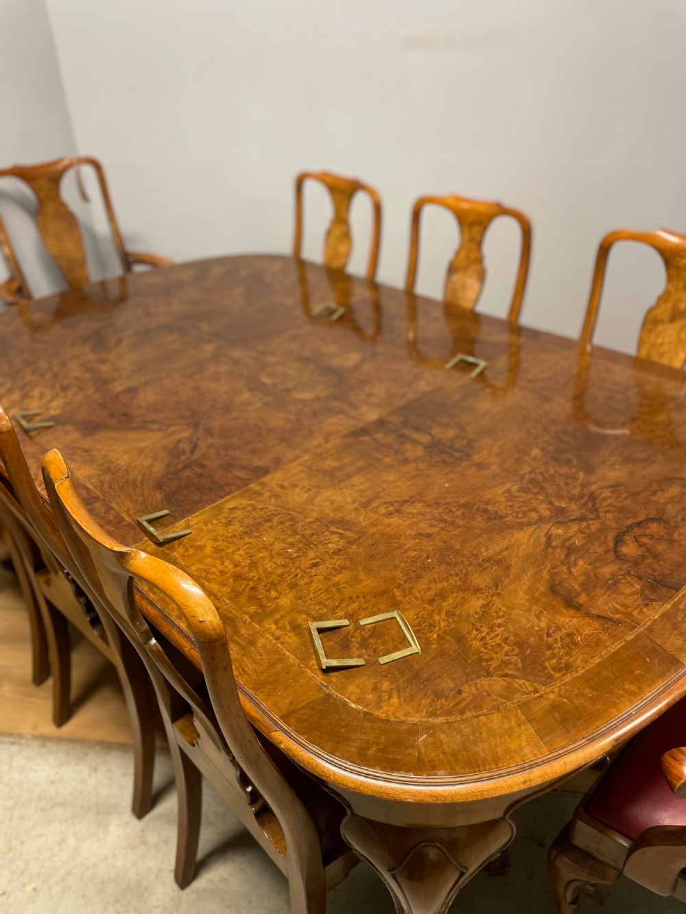 Burr walnut extending dining table by Maple and Co  View XVIII