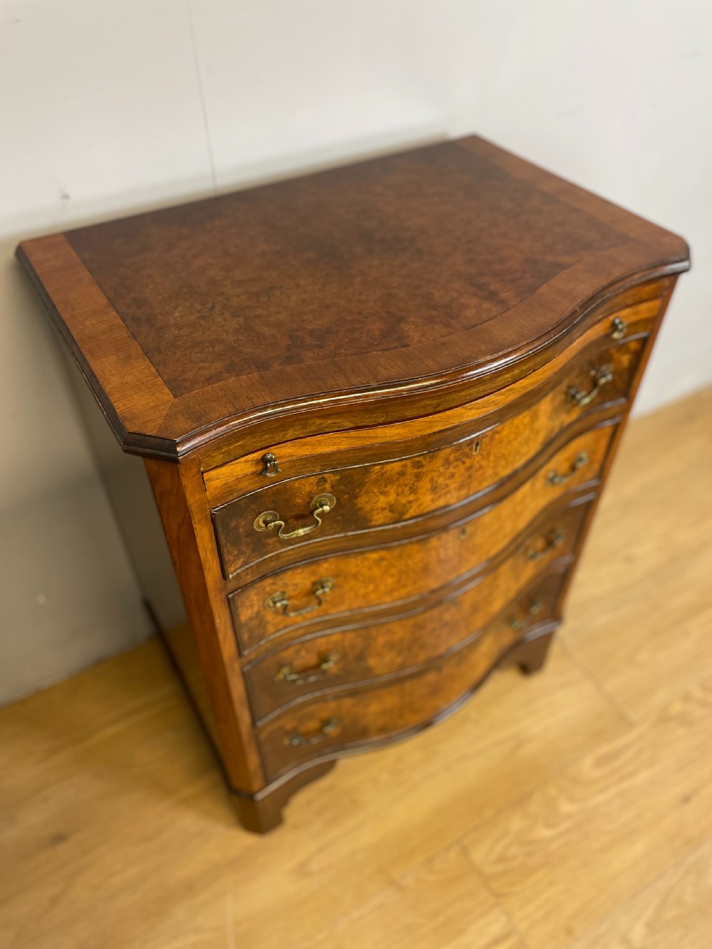 Small serpentine fronted burr walnut chest of drawers  View II