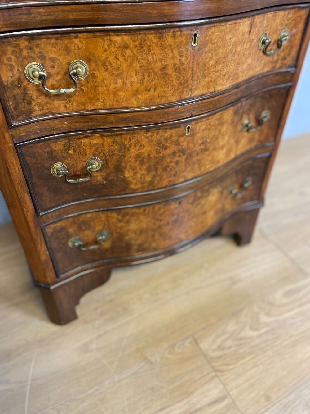 Small serpentine fronted burr walnut chest of drawers  View V