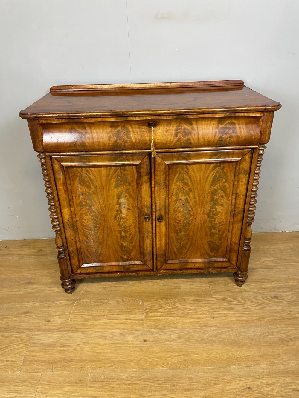 Nineteenth century Biedermeier flame mahogany side cabinet 