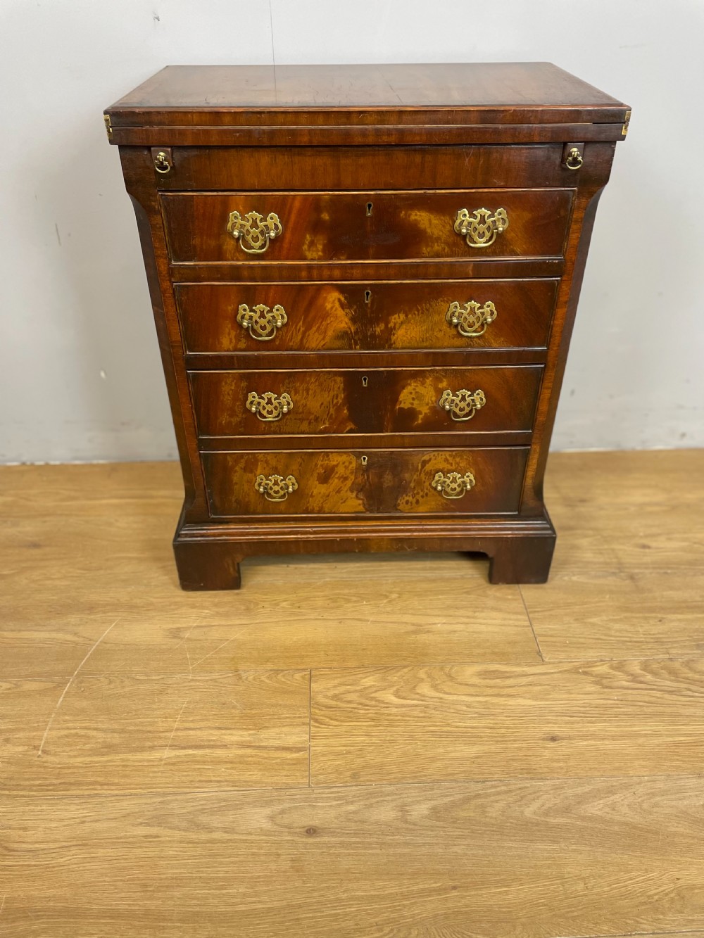 Small Flame mahogany bachelor chest of drawers circa 1920 View II