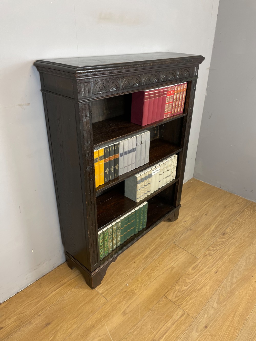 Edwardian carved oak open bookshelves  View II