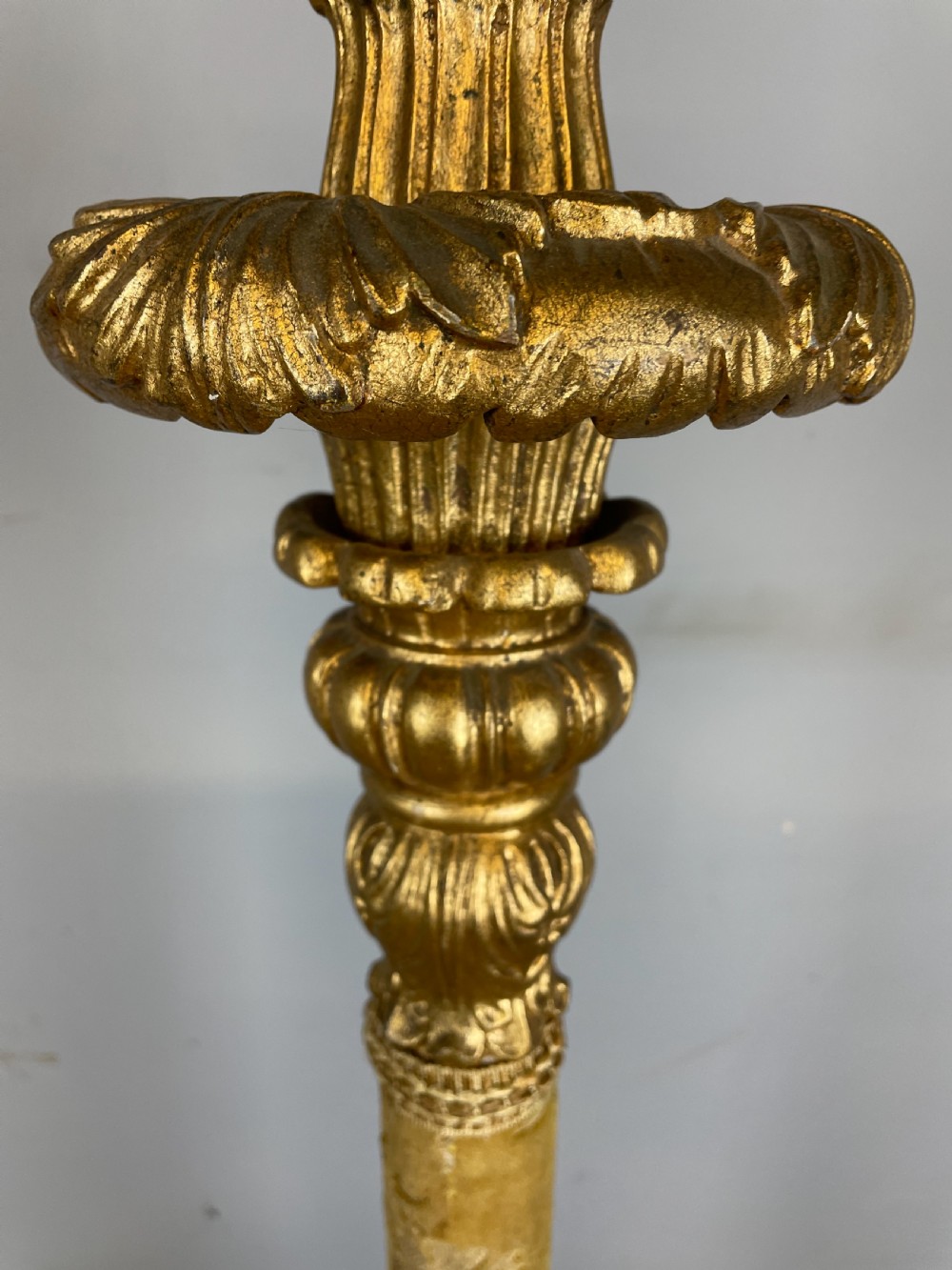 An Italian carved giltwood standard lamp with floral fabric central column details and a leaf-carved circular base. View IX