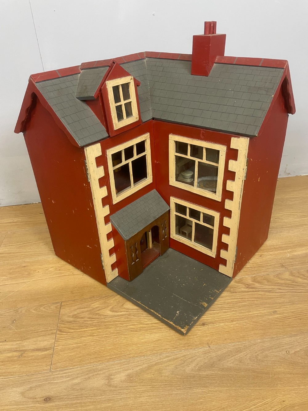 Naive early 20th century corner dolls house